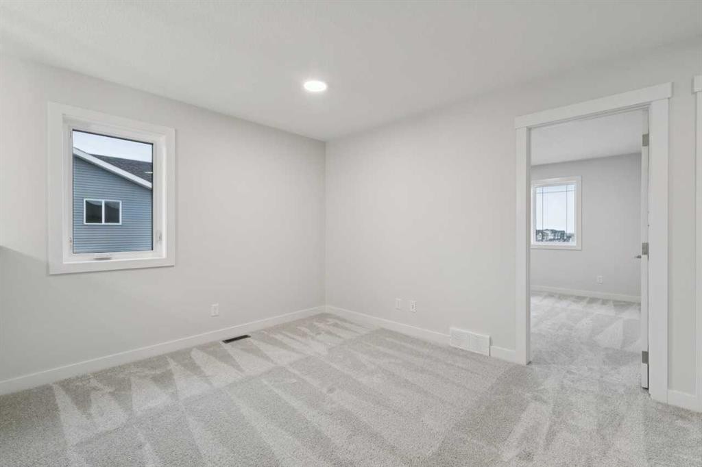 85 Southborough Square, Cochrane, AB - Indoor Photo Showing Other Room
