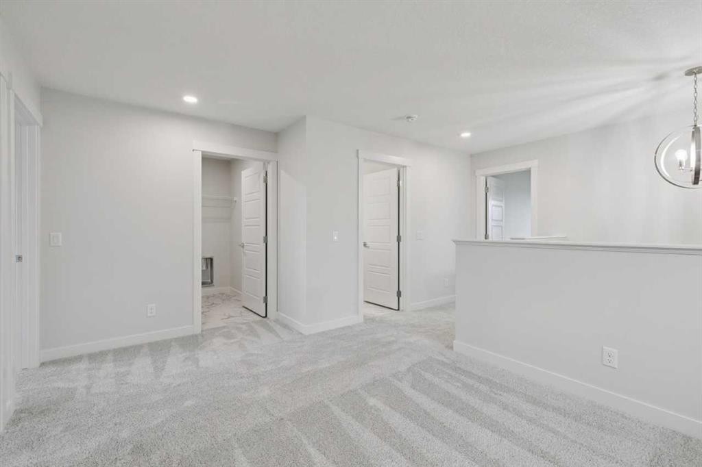 85 Southborough Square, Cochrane, AB - Indoor Photo Showing Other Room