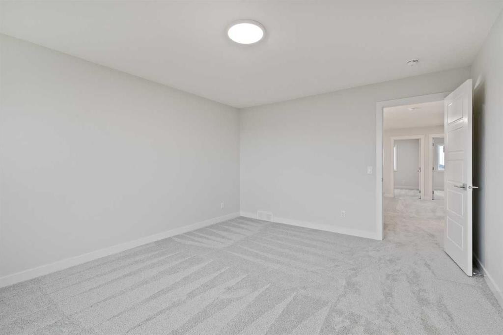 85 Southborough Square, Cochrane, AB - Indoor Photo Showing Other Room