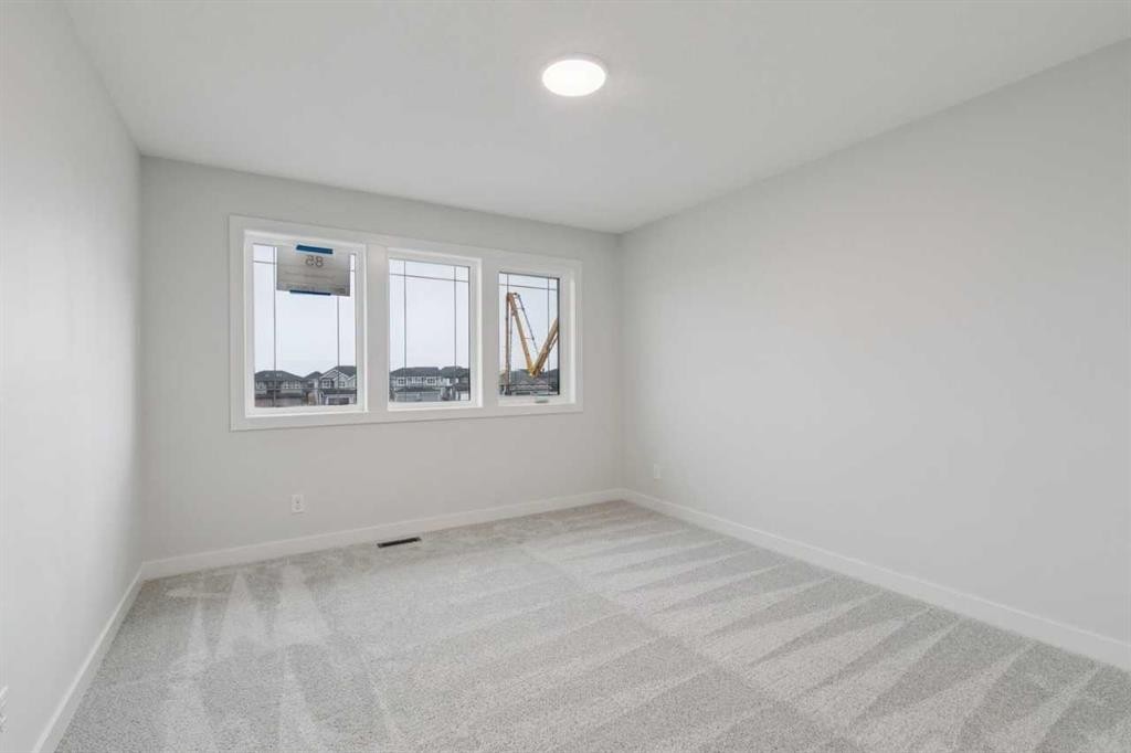 85 Southborough Square, Cochrane, AB - Indoor Photo Showing Other Room