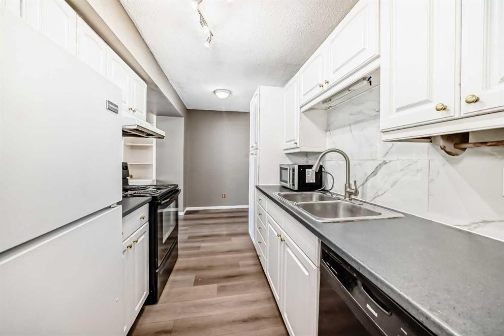B1-35 Nash, Red Deer, AB - Indoor Photo Showing Kitchen With Double Sink