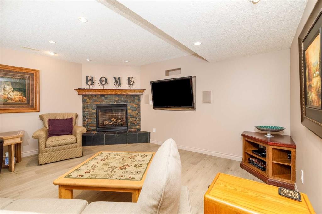 76 Daniel Close, Red Deer, AB - Indoor Photo Showing Living Room With Fireplace
