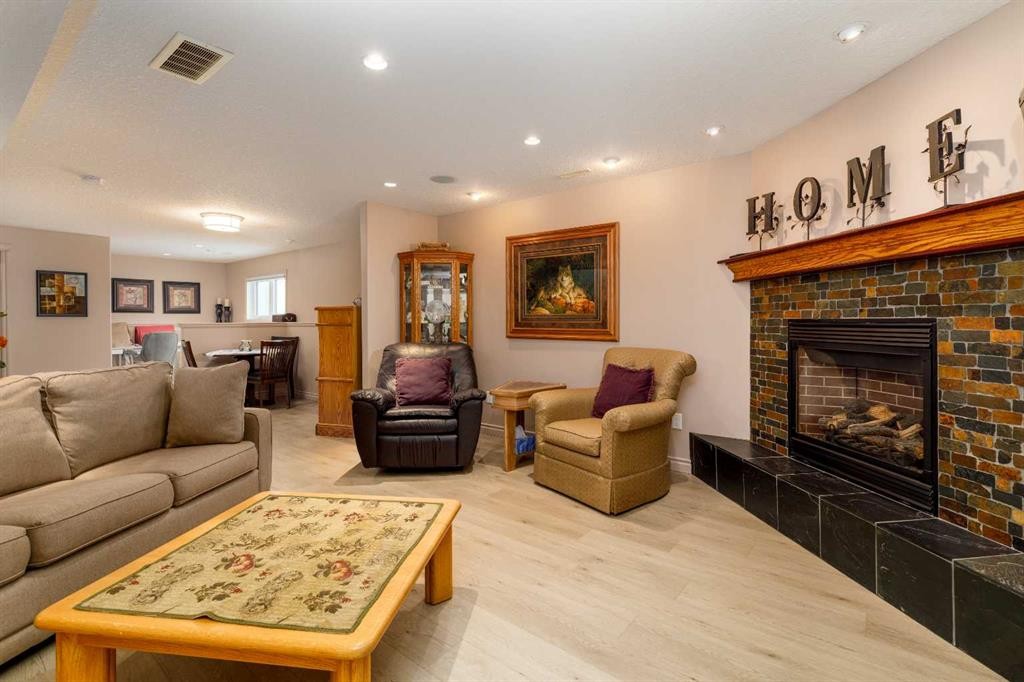 76 Daniel Close, Red Deer, AB - Indoor Photo Showing Living Room With Fireplace
