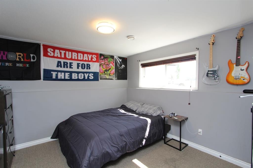 26 Wilkinson Circle, Sylvan Lake, AB - Indoor Photo Showing Bedroom