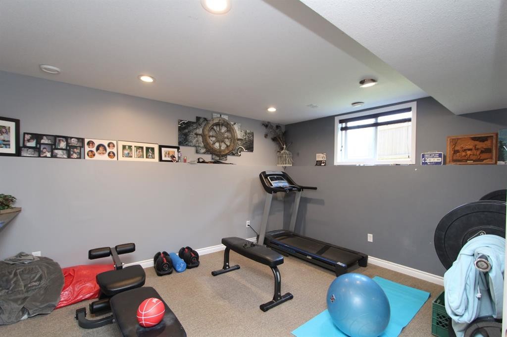 26 Wilkinson Circle, Sylvan Lake, AB - Indoor Photo Showing Gym Room