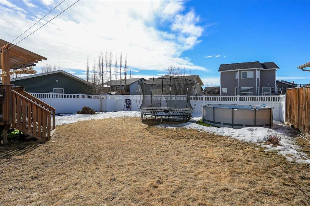 98 Pine Crescent, Blackfalds, AB - Outdoor With Above Ground Pool