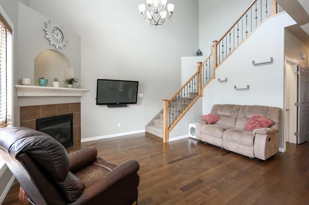 98 Pine Crescent, Blackfalds, AB - Indoor Photo Showing Living Room With Fireplace