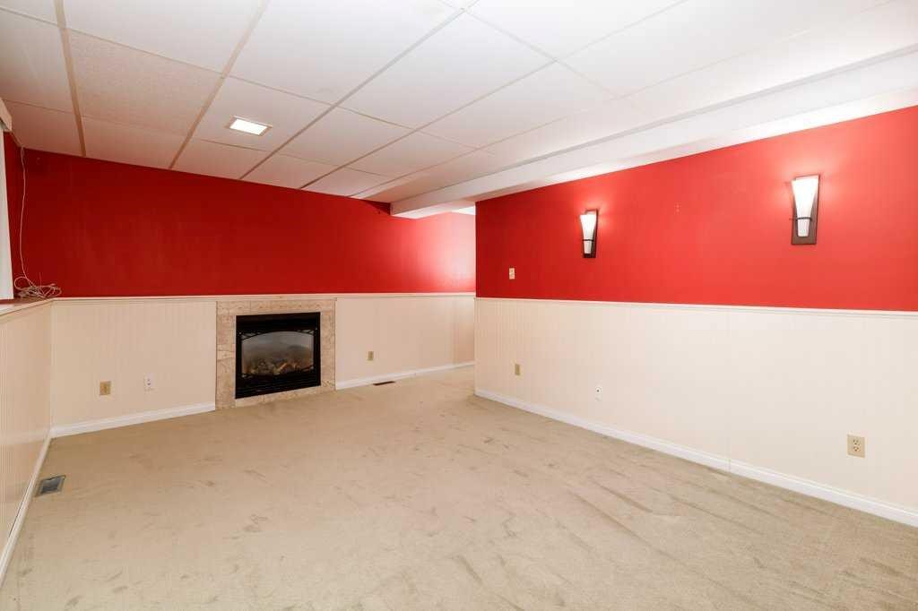 32 Greig Drive, Red Deer, AB - Indoor Photo Showing Other Room With Fireplace