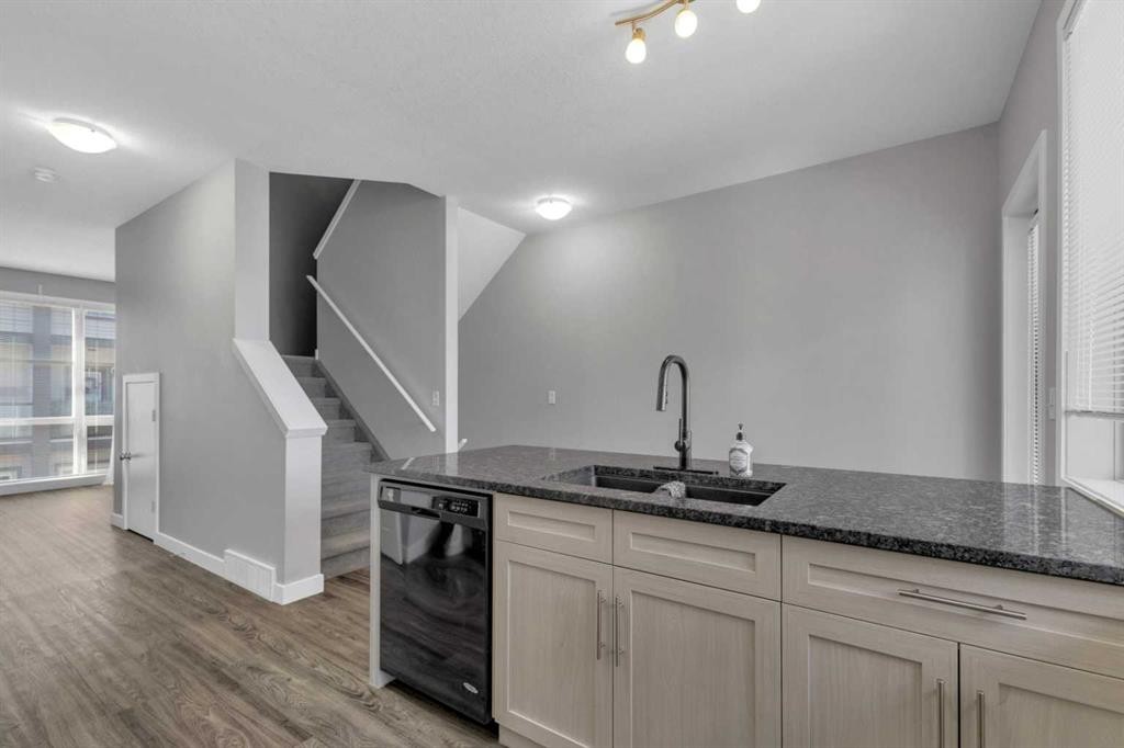 304-125 Caribou Crescent, Red Deer, AB - Indoor Photo Showing Kitchen With Double Sink