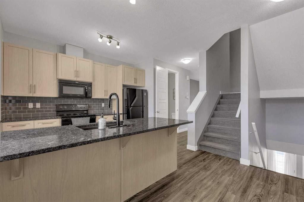 304-125 Caribou Crescent, Red Deer, AB - Indoor Photo Showing Kitchen With Double Sink With Upgraded Kitchen