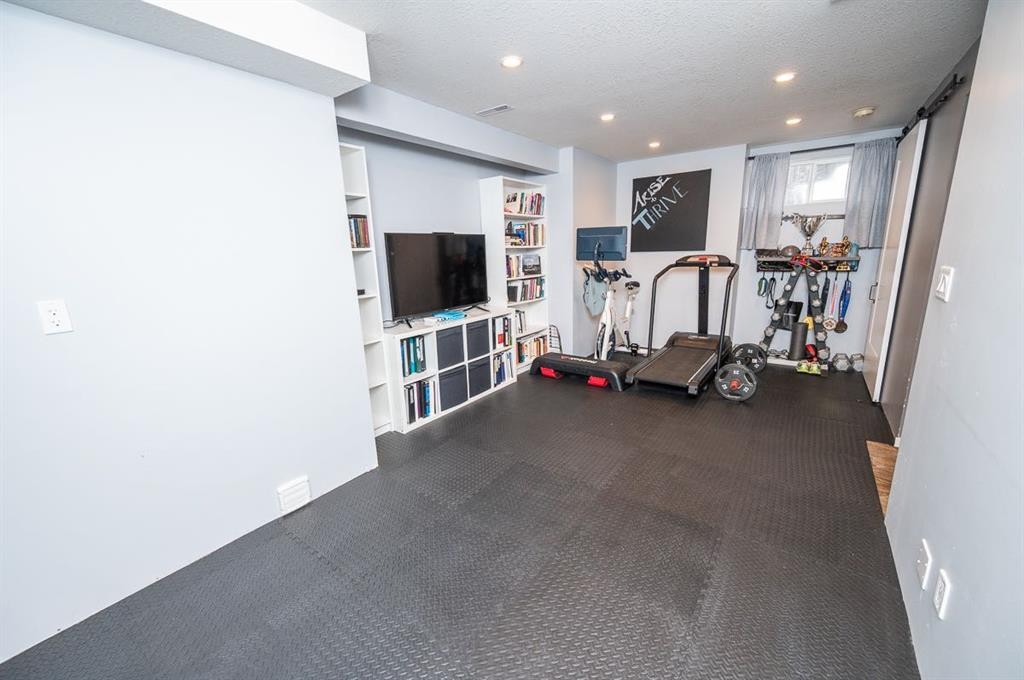 75 Doherty Close, Red Deer, AB - Indoor Photo Showing Gym Room