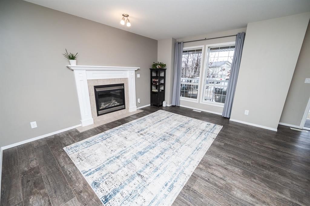 75 Doherty Close, Red Deer, AB - Indoor Photo Showing Living Room With Fireplace