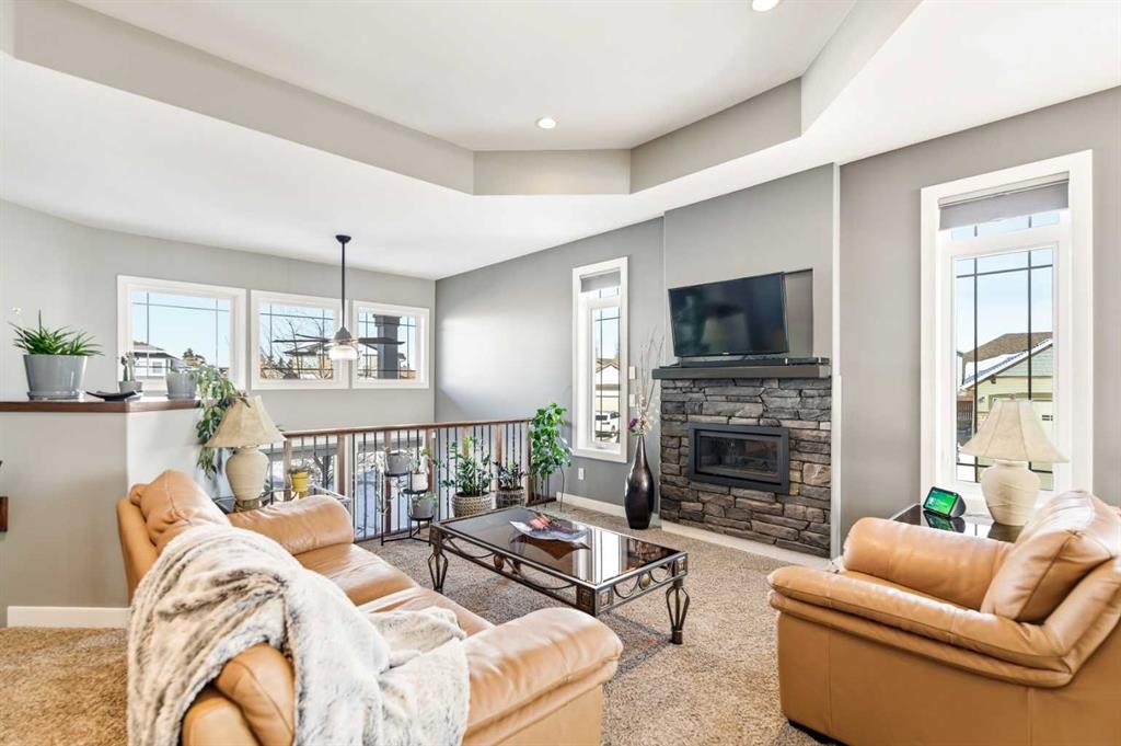 35 Bowman Circle, Sylvan Lake, AB - Indoor Photo Showing Living Room With Fireplace