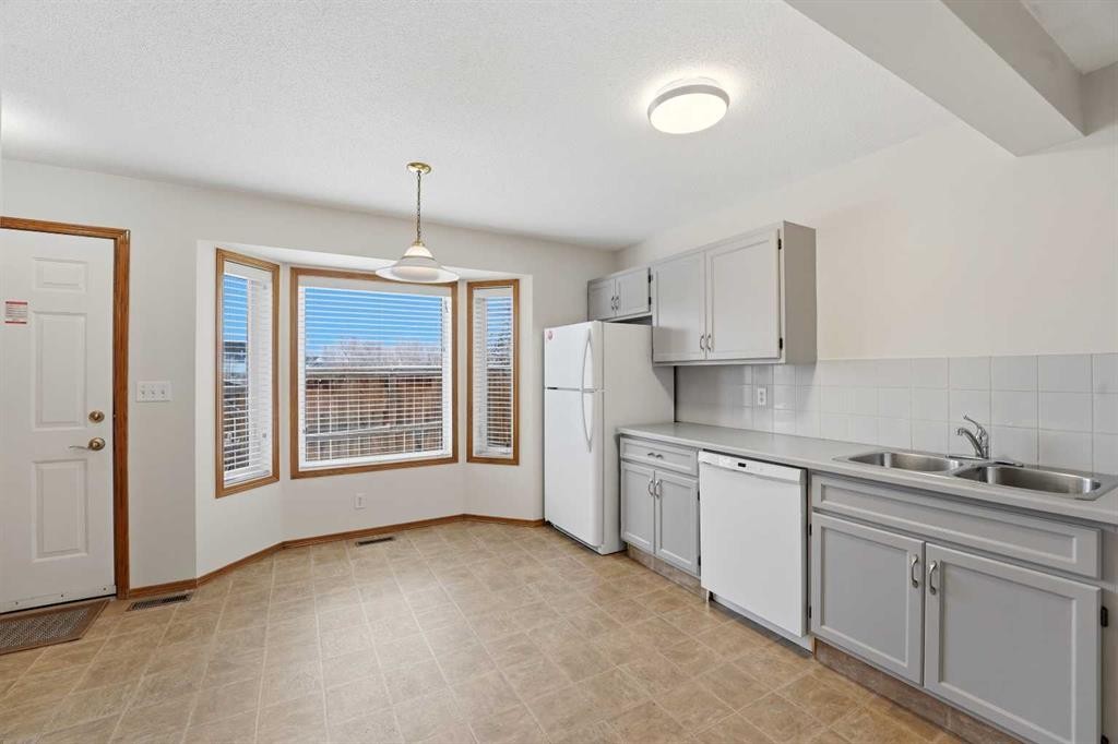 2 Davis Close, Red Deer, AB - Indoor Photo Showing Kitchen With Double Sink