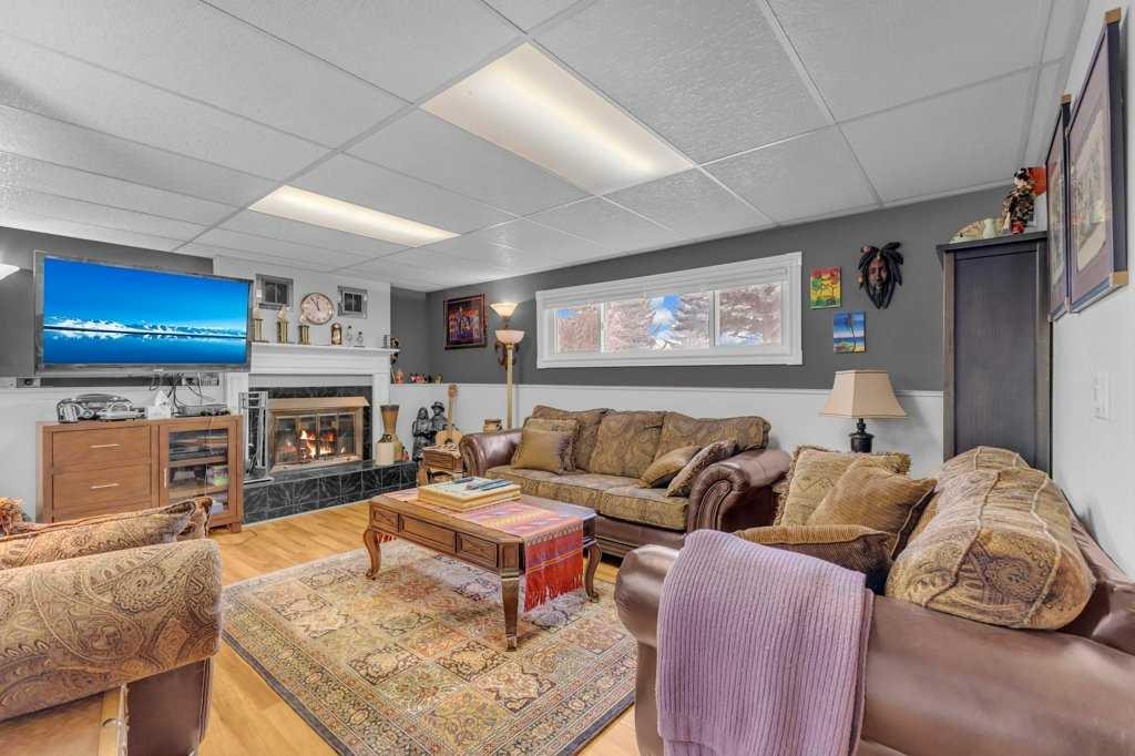 16 Markle Crescent, Red Deer, AB - Indoor Photo Showing Living Room With Fireplace