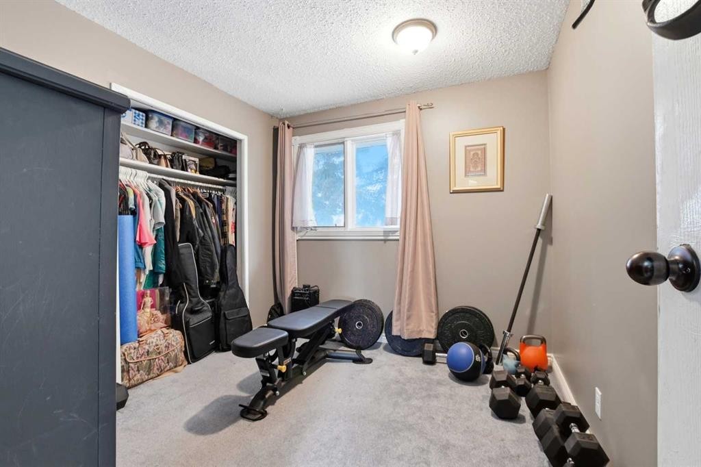 39 Norris Close, Red Deer, AB - Indoor Photo Showing Gym Room