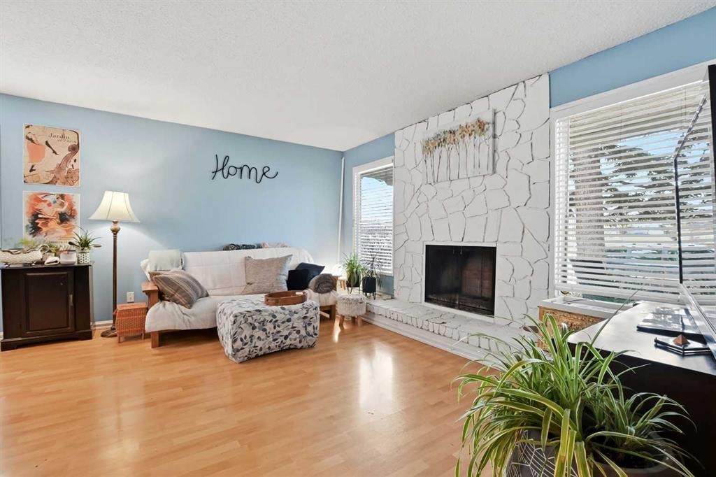 39 Norris Close, Red Deer, AB - Indoor Photo Showing Living Room With Fireplace