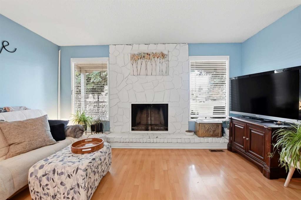 39 Norris Close, Red Deer, AB - Indoor Photo Showing Living Room With Fireplace