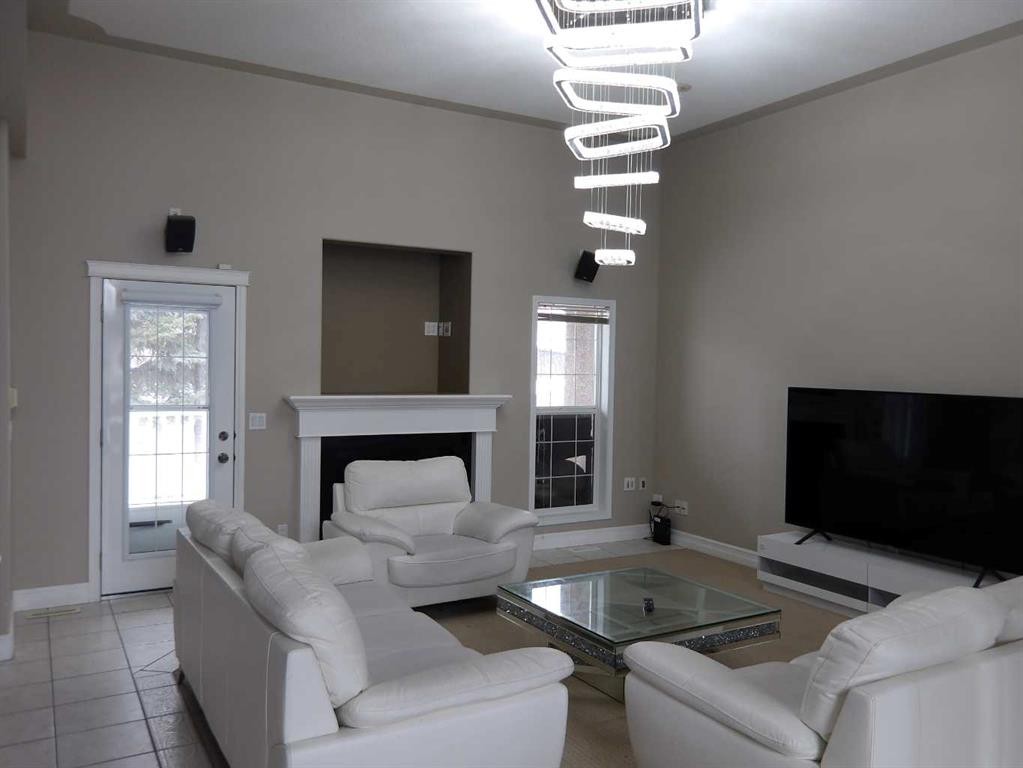 39 Ashley Close, Red Deer, AB - Indoor Photo Showing Living Room With Fireplace