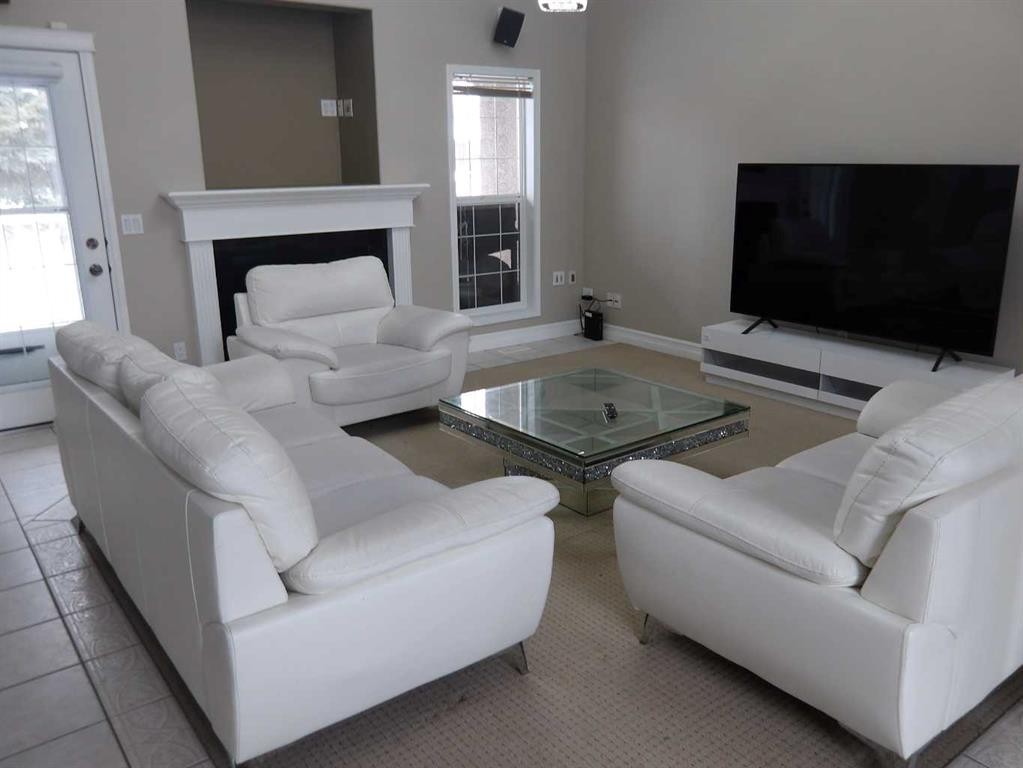 39 Ashley Close, Red Deer, AB - Indoor Photo Showing Living Room With Fireplace