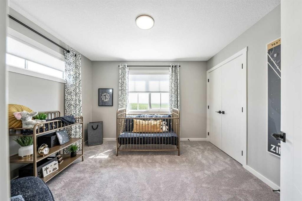 56 Osprey Hill Place Sw, Calgary, AB - Indoor Photo Showing Bedroom
