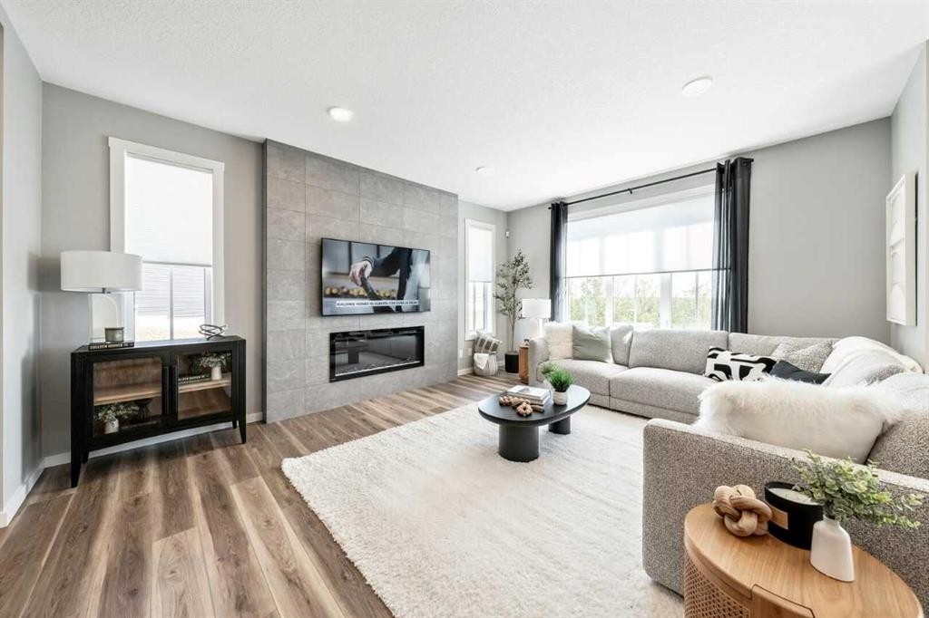 56 Osprey Hill Place Sw, Calgary, AB - Indoor Photo Showing Living Room With Fireplace