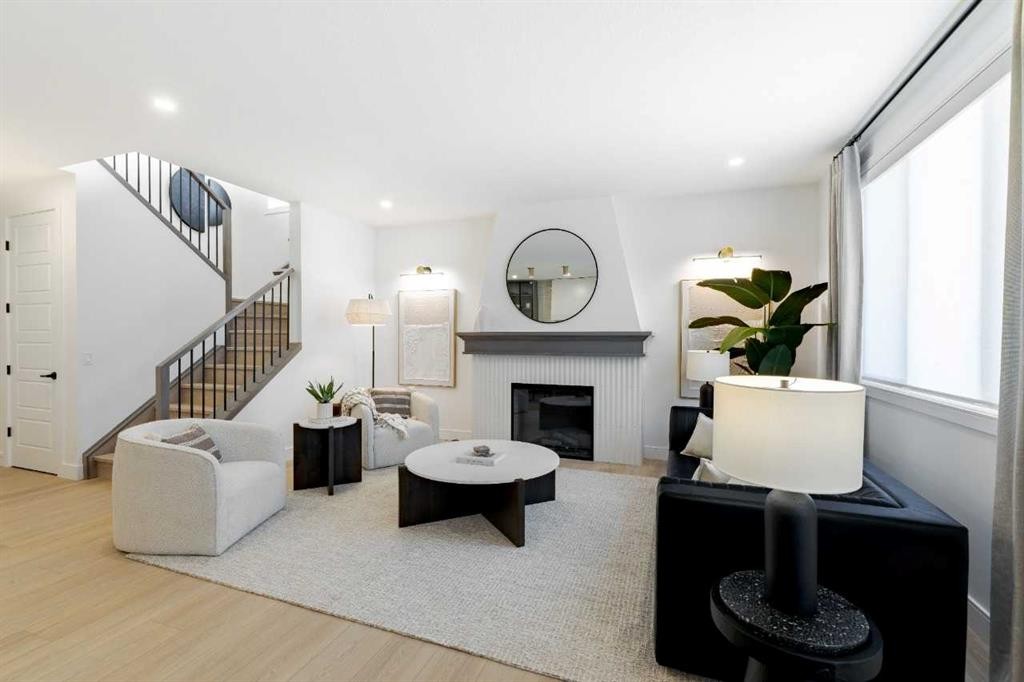 236 Amblestone Crescent Nw, Calgary, AB - Indoor Photo Showing Living Room With Fireplace
