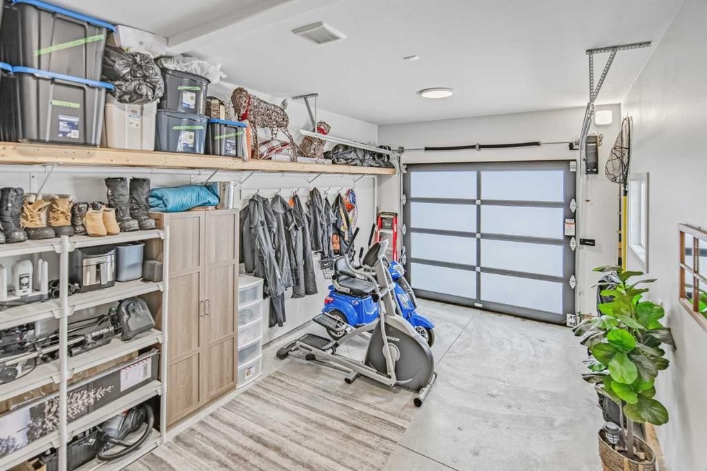 52 Iron Gate Boulevard, Sylvan Lake, AB - Indoor Photo Showing Garage