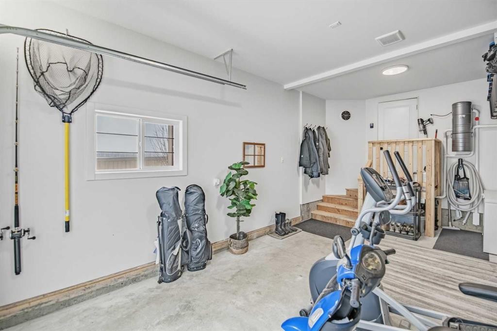 52 Iron Gate Boulevard, Sylvan Lake, AB - Indoor Photo Showing Gym Room