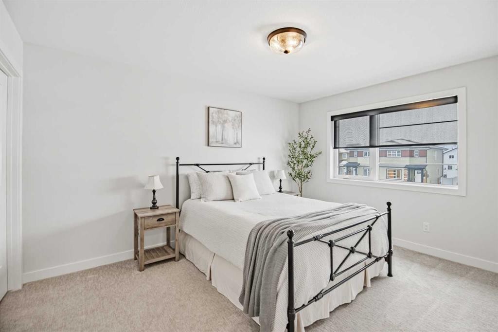 52 Iron Gate Boulevard, Sylvan Lake, AB - Indoor Photo Showing Bedroom