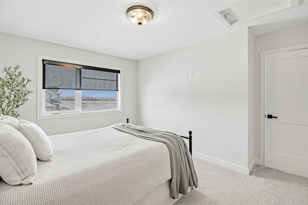 52 Iron Gate Boulevard, Sylvan Lake, AB - Indoor Photo Showing Bedroom