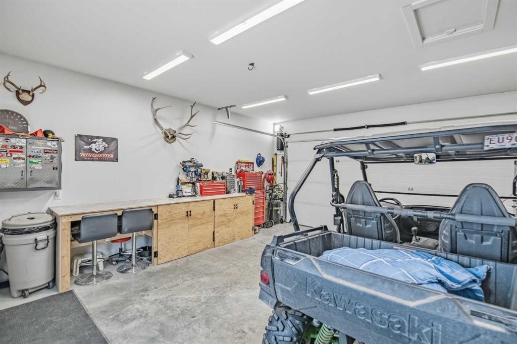 52 Iron Gate Boulevard, Sylvan Lake, AB - Indoor Photo Showing Garage