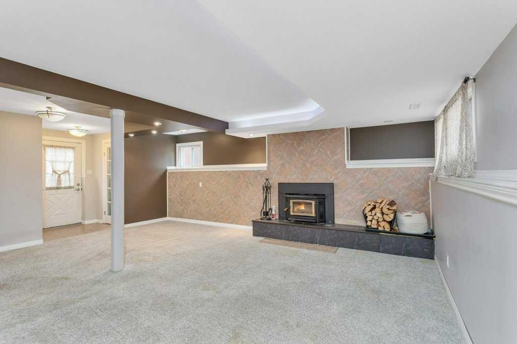7 Nellis Avenue, Red Deer, AB - Indoor With Fireplace