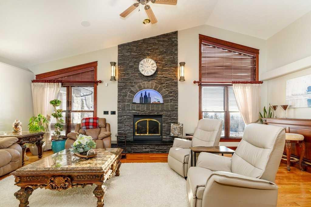 85 Oberlin Avenue, Red Deer, AB - Indoor Photo Showing Living Room With Fireplace