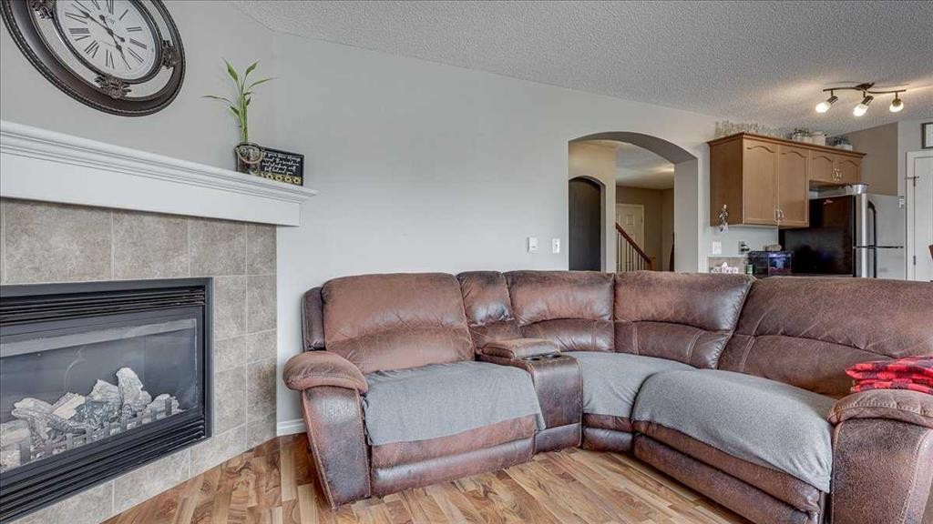 148 Valley Crescent, Blackfalds, AB - Indoor Photo Showing Living Room With Fireplace