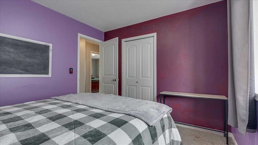 148 Valley Crescent, Blackfalds, AB - Indoor Photo Showing Bedroom