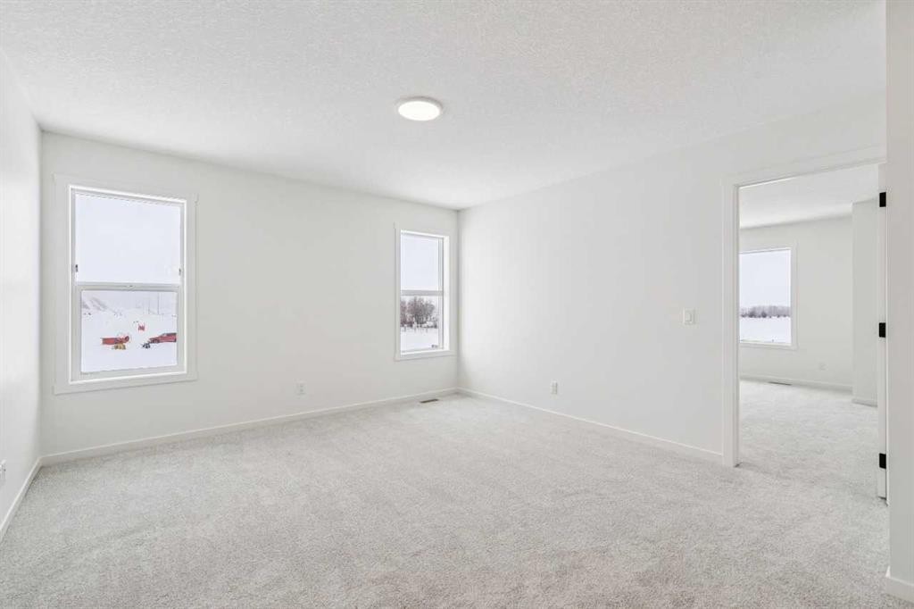 208 Southborough Common, Cochrane, AB - Indoor Photo Showing Other Room