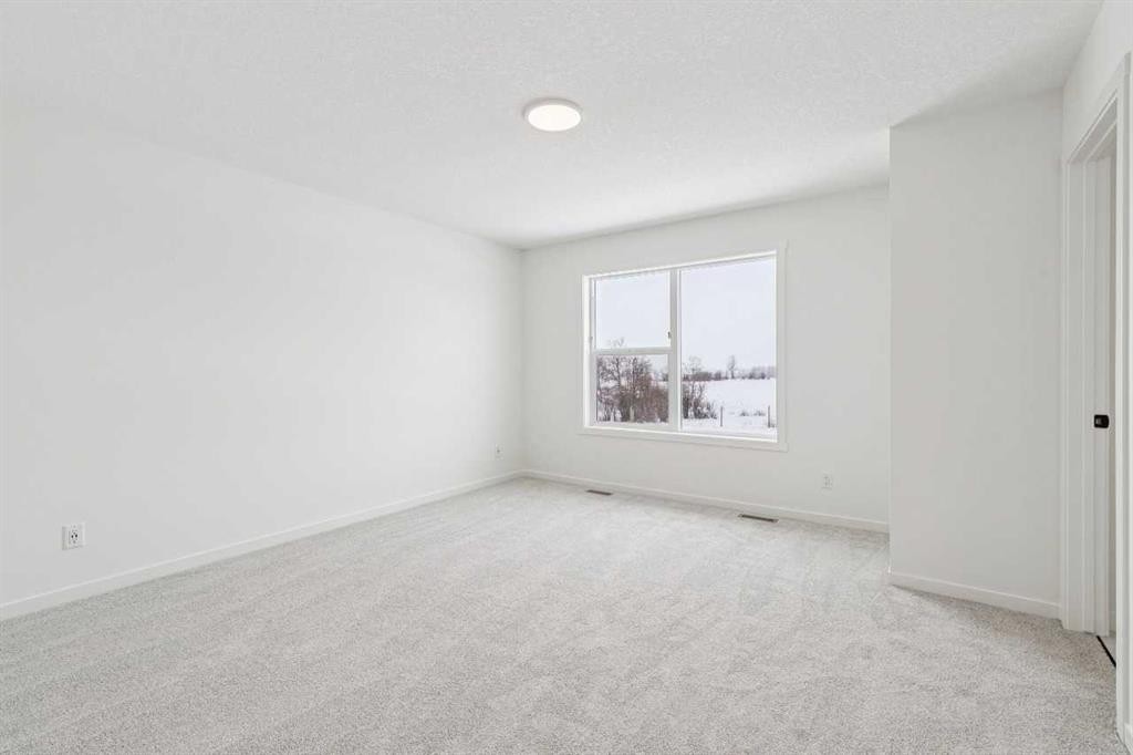 208 Southborough Common, Cochrane, AB - Indoor Photo Showing Other Room