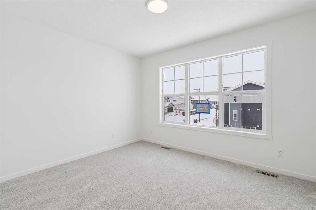 208 Southborough Common, Cochrane, AB - Indoor Photo Showing Other Room