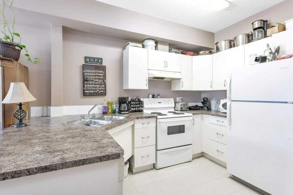 108-80A Kelloway Crescent, Red Deer, AB - Indoor Photo Showing Kitchen With Double Sink