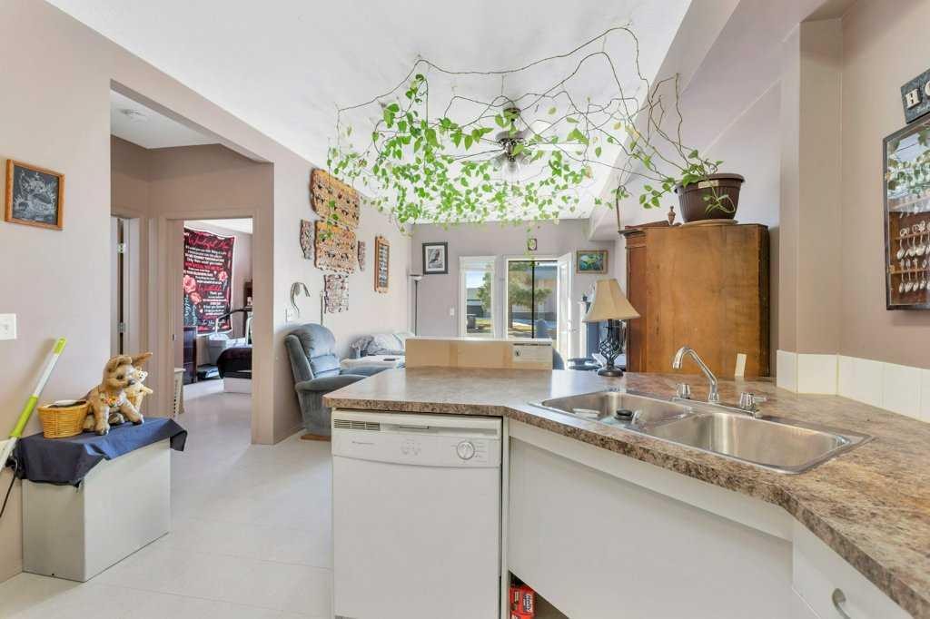 108-80A Kelloway Crescent, Red Deer, AB - Indoor Photo Showing Kitchen With Double Sink