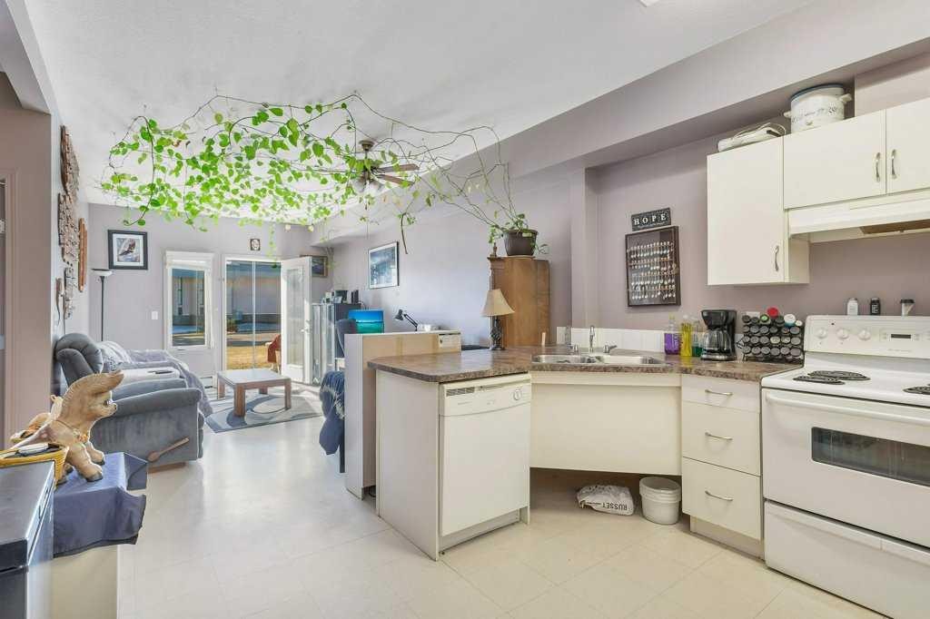 108-80A Kelloway Crescent, Red Deer, AB - Indoor Photo Showing Kitchen With Double Sink