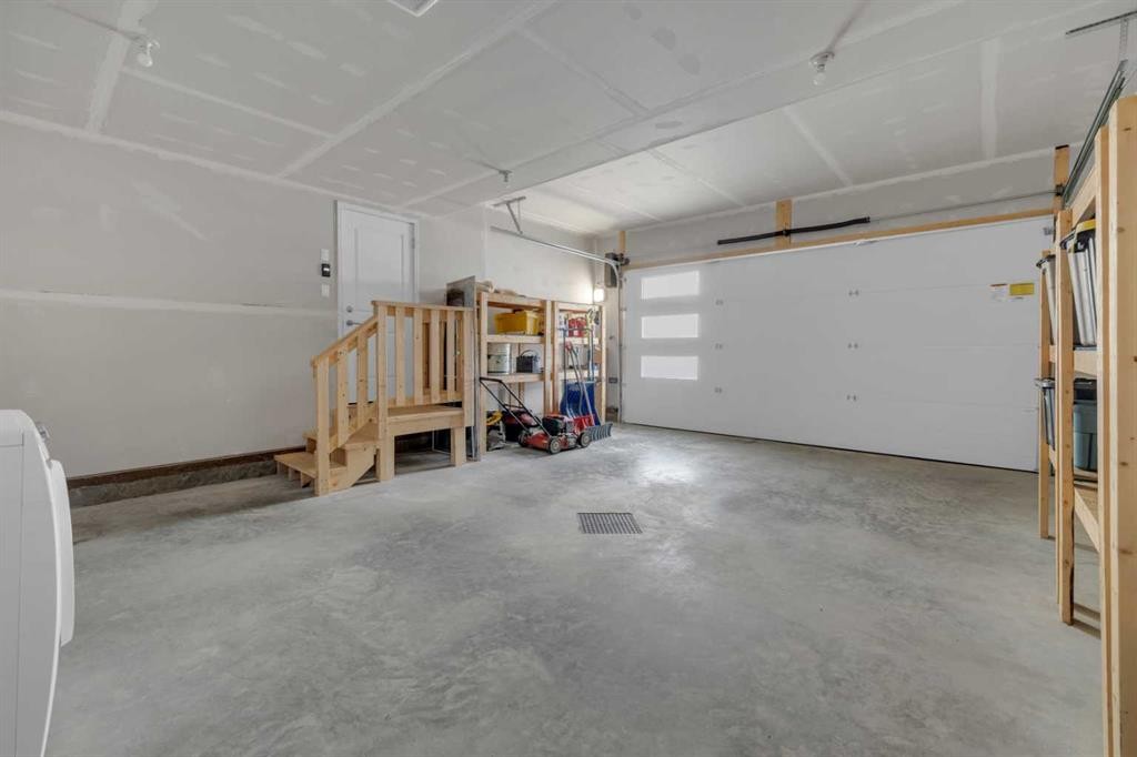 13 Vanson Close, Sylvan Lake, AB - Indoor Photo Showing Garage
