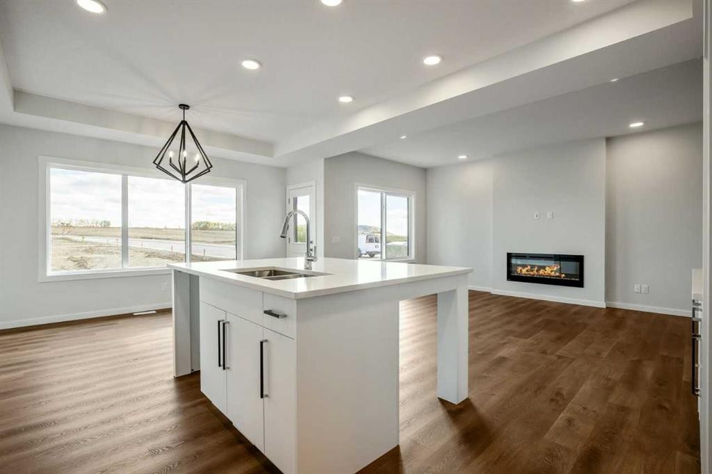 27 Heritage Link, Cochrane, AB - Indoor Photo Showing Other Room With Fireplace