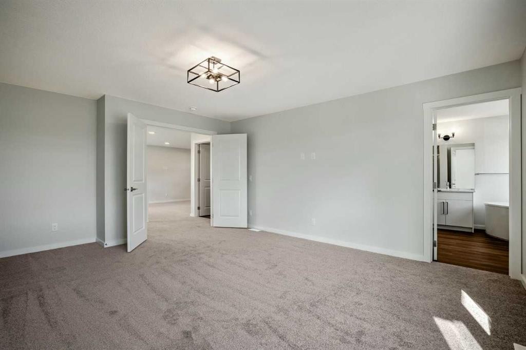 27 Heritage Link, Cochrane, AB - Indoor Photo Showing Other Room