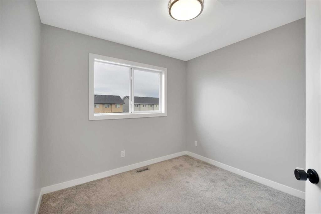 15 Iron Gate Boulevard, Sylvan Lake, AB - Indoor Photo Showing Other Room