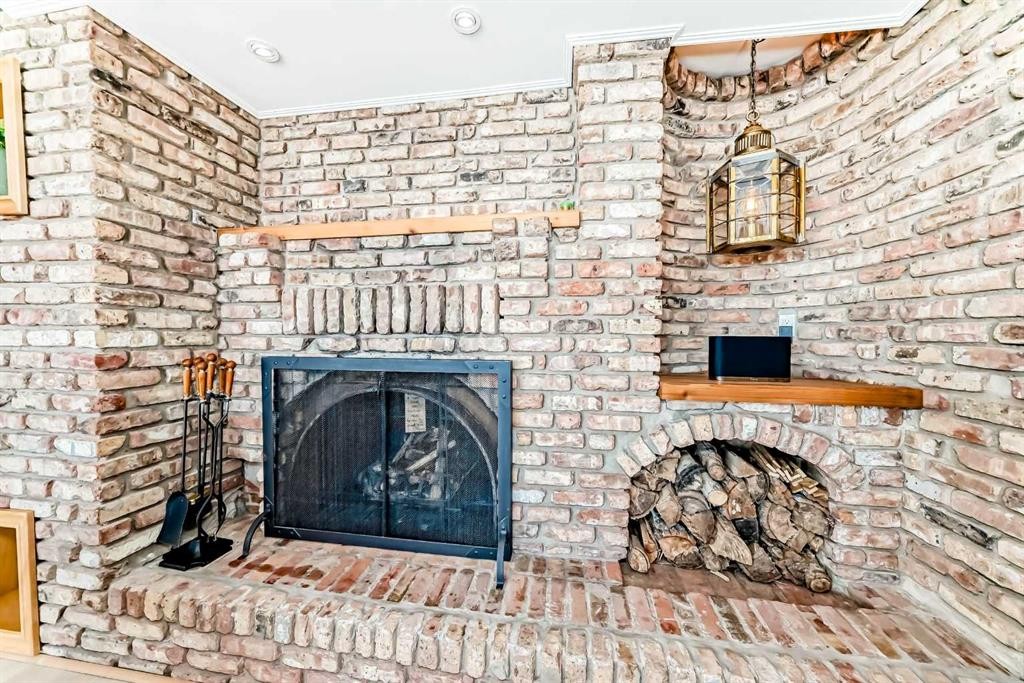 157 Grand Avenue, Norglenwold, AB - Indoor Photo Showing Living Room With Fireplace