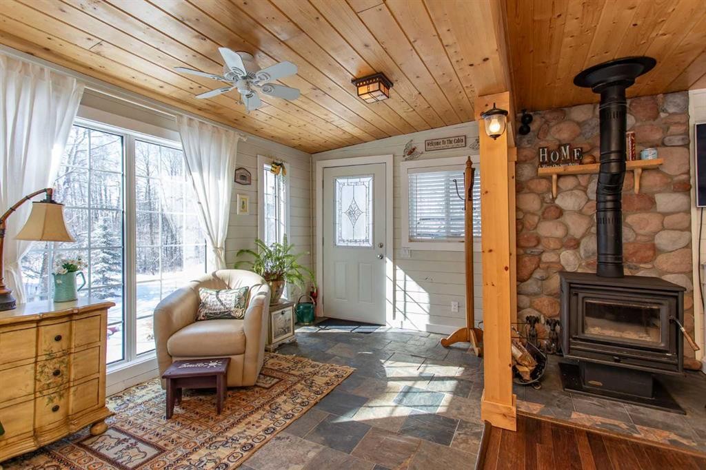 1130 Breakers Way, Sunbreaker Cove, AB - Indoor Photo Showing Other Room With Fireplace