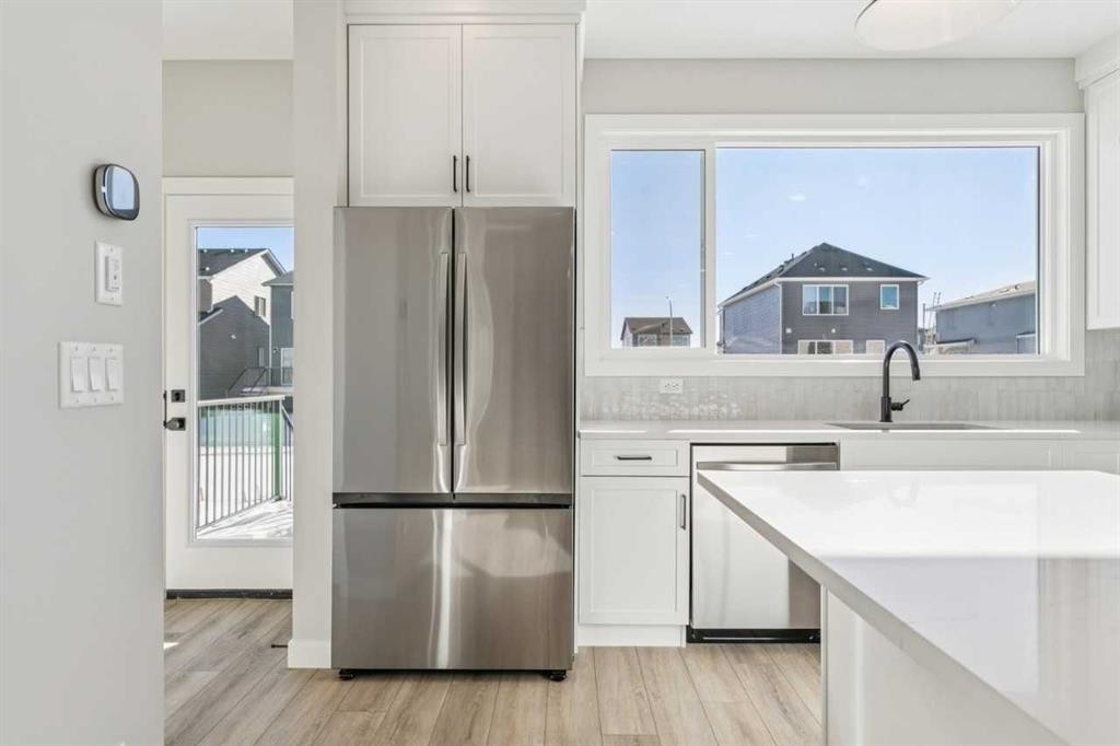 335 Fireside Drive, Cochrane, AB - Indoor Photo Showing Kitchen With Upgraded Kitchen