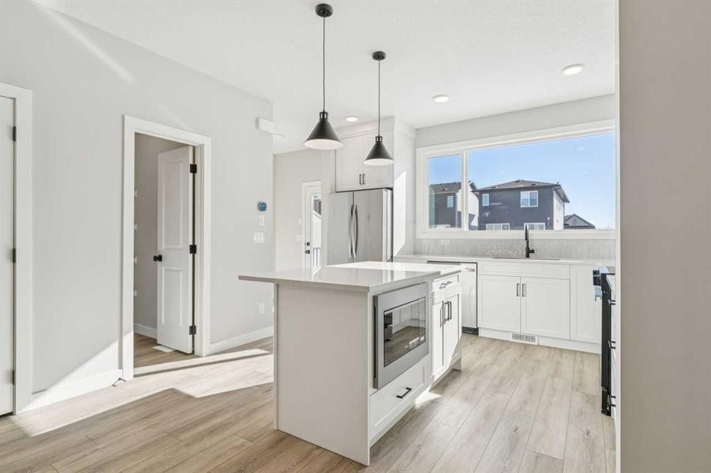 335 Fireside Drive, Cochrane, AB - Indoor Photo Showing Kitchen With Upgraded Kitchen